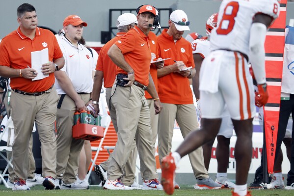 Clemson head coach Dabo Swinney watches a reply from the sideline during the second half of an NCAA college football game against North Carolina State in Raleigh, N.C., Saturday, Oct. 28, 2023. (AP Photo/Karl B DeBlaker)