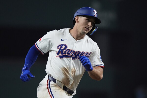 Rangers place LF Wyatt Langford on 10-day injured list with an abdominal  muscle strain | AP News
