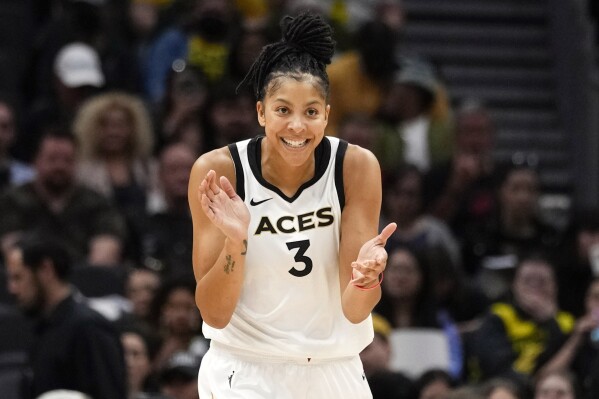 FILE - Las Vegas Aces forward Candace Parker (3) reacts during the first half of a WNBA basketball game against the Seattle Storm, Saturday, May 20, 2023, in Seattle. The Las Vegas Aces announced Wednesday, Feb. 7, 2024, they re-signed Candace Parker. She is a two-time league MVP and three-time WNBA champion. The Aces have won back-to-back titles (APPhoto/Lindsey Wasson, File)