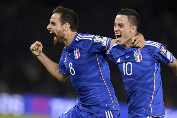 Italy's Giacomo Bonaventura, left, celebrates after scoring the opening goal during the Euro 2024 group C qualifying soccer match between Italy and Malta in Bari, Italy, Saturday, Oct. 14, 2023. ( Fabio Ferrari/LaPresse via AP)