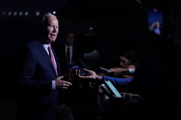 FILE - President Joe Biden speaks to members of the media before boarding Air Force One in Norfolk, Va., Nov. 19, 2023. Biden declared an emergency over lead contamination in the U.S. Virgin Islands water after tests on St. Croix revealed levels more than 100 times the limits set by the Environmental Protection Agency. (AP Photo/Manuel Balce Ceneta, File)