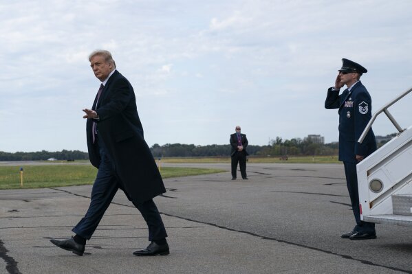 President Donald Trump arrives at Morristown Municipal Airport to attend a fundraiser at Trump National Golf Club in Bedminster, Thursday, Oct. 1, 2020, in Morristown, N.J. (AP Photo/Evan Vucci)