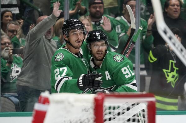Dallas Stars left wing Mason Marchment (27) and center Tyler Seguin (91) celebrate a goal scored by Seguin in the first period of a NHL hockey game against the Winnipeg Jets in Dallas, Monday, Oct. 17, 2022. (AP Photo/Tony Gutierrez)
