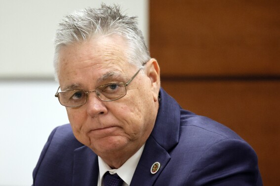 FILE - Former Marjory Stoneman Douglas High School School Resource Officer Scot Peterson sits at the defense table during his trial at the Broward County Courthouse in Fort Lauderdale, Fla., Friday, June 23, 2023. A lawsuit filed by the families of the 17 killed in the 2018 Parkland, Fla., school massacre and survivors against Peterson, who was on campus, can go forward, Circuit Judge Carol-Lisa Phillips ruled Wednesday, Jan. 10, 2024, rejecting his motion to dismiss the case before trial. (Amy Beth Bennett/South Florida Sun-Sentinel via AP, Pool, File)