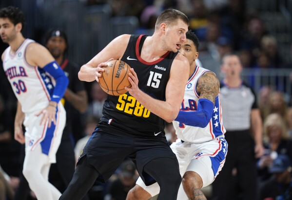 Jokic, Nuggets fend off gritty 76ers 111-105 as Embiid sits out