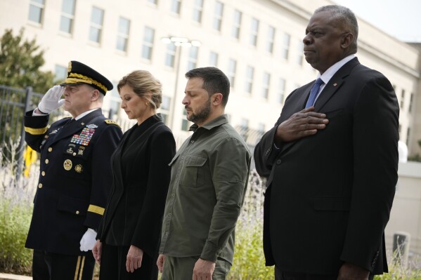 From left, Chairman of the Joint Chiefs Gen. Mark Milley, first lady of Ukraine Olena Zelenska, Ukrainian President Volodymyr Zelenskyy and Secretary of Defense Lloyd Austin, participate in a wreath laying ceremony at the 9/11 Pentagon Memorial, Thursday, Sept. 21, 2023, in Washington. (AP Photo/Andrew Harnik)