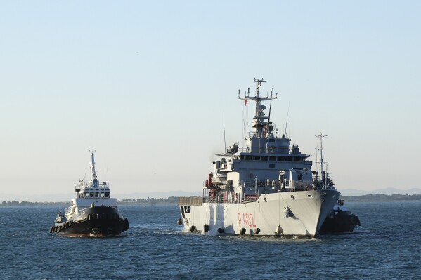 The Italian navy ship Libra arrives at the port of Shengjin northwestern Albania Wednesday, Oct. 16, 2024, carrying the first group of migrants who were intercepted in international waters and redirected to Albania in force of an agreement between the two counties. (AP Photo/Vlasov Sulaj)