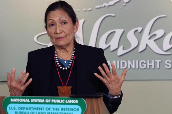 FILE -Interior Secretary Deb Haaland gestures while addressing reporters during a news conference, April 21, 2022, in Anchorage, Alaska. Haaland on Tuesday, March 14, 2023, withdrew a 2019 exchange agreement finalized during the Trump administration that has been the subject of ongoing litigation, citing a lack of public participation and environmental review. (AP Photo/Mark Thiessen, File)