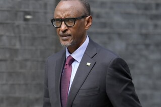 FILE — President of Rwanda Paul Kagame walks along Downing Street to a meeting with Britain's Prime Minister Rishi Sunak, in London, Thursday, May 4, 2023. Rwanda announced Thursday, Nov. 2, 2023 visa-free entry for all Africans, becoming the latest nation on the continent to announce such a measure aimed at boosting free movement of people and trade to rival Europe’s Schengen zone. President Paul Kagame made the announcement in the Rwandan capital, Kigali, where he pitched the potential of Africa as “a unified tourism destination” for a continent that still relies on 60% of its tourists from outside Africa, according to data from the United Nations Economic Commission for Africa.(AP Photo/Vadim Ghirda-File)