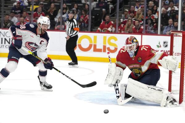 Florida Panthers goaltender Sergei Bobrovsky (72) defends the goal against Columbus Blue Jackets center Boone Jenner (38) during the first period of an NHL hockey game, Tuesday, Dec. 13, 2022, in Sunrise, Fla. (AP Photo/Lynne Sladky)