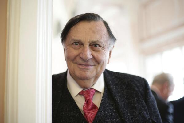 Barry Humphries arrives for the Oldie of the Year awards, at Simpsons-in-the-Strand, London, on Feb. 2, 2016. Tony Award-winning comedian Barry Humphries, renowned for his garish stage persona Dame Edna Everage, a condescending and imperfectly veiled snob whose evolving character has delighted audiences over seven decades, is in a Sydney hospital with complications following hip surgery. St. Vincent’s Hospital described the 89-year-old’s condition on Friday April 21, 2023 as stable and rejected media reports that he had become unresponsive. (Yui Mok/PA via AP)