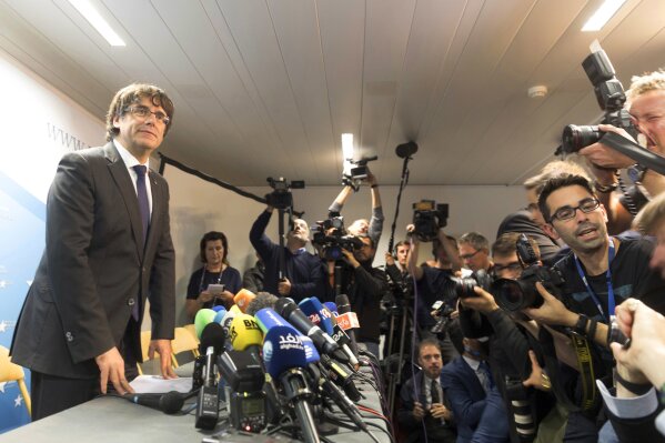 
              Sacked Catalonian President Carles Puigdemont looks on after a press conference in Brussels, Tuesday, Oct. 31, 2017. Ousted Catalan President Carles Puigdemont is calling for avoiding violence and says dialogue is a priority during his first address on Belgian soil. Puigdemont on Tuesday recapped the issues which led him to leave for Belgium the previous day, but did not immediately say in his statement what he would do in Brussels or whether he would seek asylum. (AP Photo/Olivier Matthys)
            