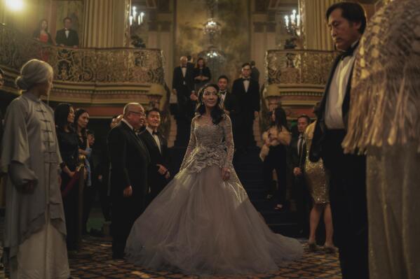 This image released by A24 shows Michelle Yeoh, center, in a scene from "Everything Everywhere All At Once." (Allyson Riggs/A24 via AP)