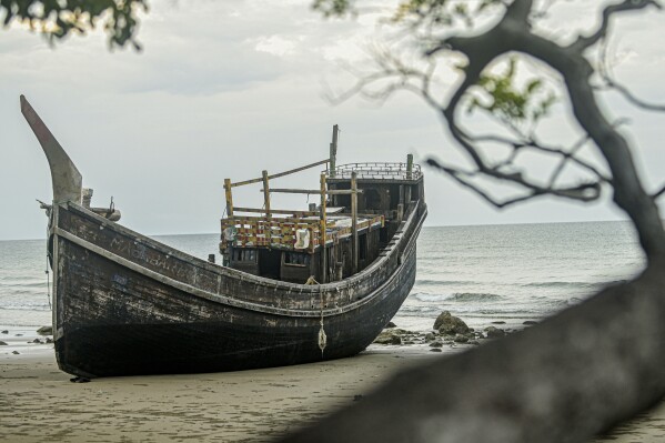 A boat used to transport a group of Rohingya Muslims rests on the beach where it landed on Dec. 10 in Pidi, Aceh province, Indonesia, Saturday, Dec. 16, 2023.  (AP Photo/Reza Saifullah)