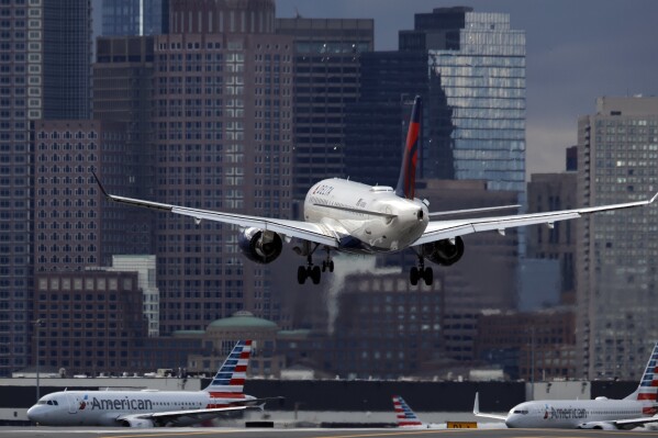 FILE - A Delta Air Lines plane lands at Logan International Airport, Jan. 26, 2023, in Boston. Delta reports earnings on Wednesday, April 10, 2024. (AP Photo/Michael Dwyer, File)