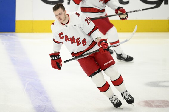 Carolina Hurricanes defenseman Alexander Nikishin (21) warms up before Game 5 of a second-round NHL hockey playoff series against the Washington Capitals Thursday, May 15, 2025, in Washington. (AP Photo/Nick Wass)