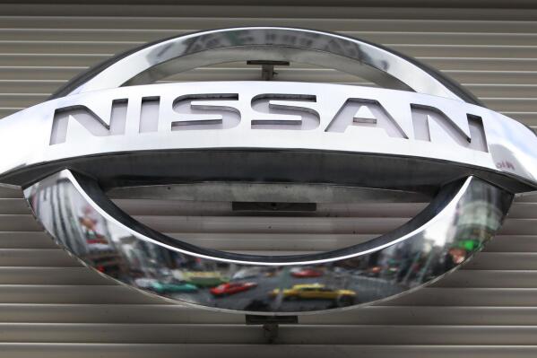 FILE - In this Wednesday, Feb. 8, 2012, file photo,  the logo of the Nissan Motors Co. is shown a showroom in Tokyo's Ginza shopping district. Nissan is recalling more than 793,000 small SUVs in the U.S. and Canada, Wednesday, Jan. 26, 2022,  because water can get into wiring and in rare cases could start a fire. The recall covers Nissan Rogue SUVs from the 2014 through 2016 model years.   (AP Photo/Shizuo Kambayashi, File)