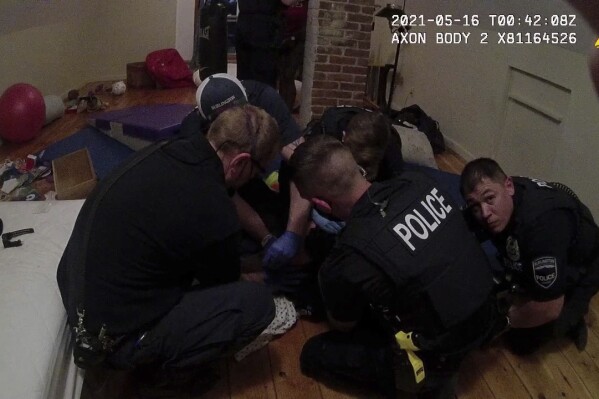 This image provided by American Civil Liberties Union of Vermont shows Burlington Police Department body cam footage of a police interaction with a Black teen late evening on May 15, 2021 in Burlington, Vt. A mother wanted to teach her then 14-year-old son a lesson after he stole electronic cigarettes from a gas station so she called police. A lawsuit by the mother alleges the Burlington police used excessive force and discriminated against her unarmed son. (Burlington Police Department/American Civil Liberties Union of Vermont via AP)