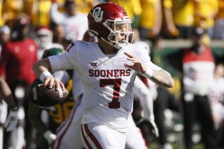 Oklahoma quarterback Spencer Rattler looks to throw down field against Baylor during the second half of an NCAA college football game in Waco, Texas, Saturday, Nov. 13, 2021. (AP Photo/Ray Carlin)