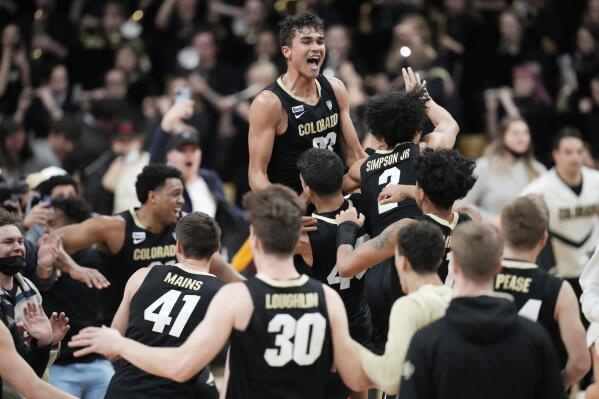 FILE - Colorado forward Tristan da Silva, top, celebrates with teammates as time runs out in the second half of an NCAA college basketball game against Arizona, Saturday, Feb. 26, 2022, in Boulder, Colo. The Colorado Buffaloes are looking for new leaders to emerge with the loss of Evan Battey and Jabari Walker. Tristan Da Silva is a candidate to step up. (AP Photo/David Zalubowski, File)