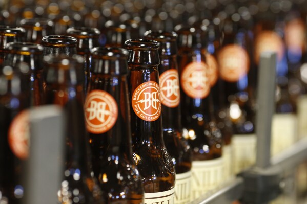 FILE - Empty bottles head down the line to be washed in the factory of Breckenridge Brewery in Littleton, Colo., on Thursday, Jan. 21, 2016. The cannabis company Tilray expanded its position in the craft brew industry with the acquisition of eight beer and beverage brands from Anheuser-Busch, including Breckenridge Brewery. Tilray said that the transaction, which was announced in August 2023, will triple its beer sales volume from four million cases to 12 million. (AP Photo/David Zalubowski, File)