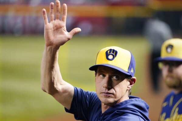FILE -Milwaukee Brewers manager Craig Counsell waves to the crowd as he is honored as a former Arizona Diamondbacks player, during the fourth inning of the team's baseball game against the Diamondbacks on Tuesday, April 11, 2023, in Phoenix. The first sign of discontent regarding Craig Counsell’s decision to leave the Milwaukee Brewers to manage the Chicago Cubs appeared in his hometown at the Little League field that bears his name.(AP Photo/Ross D. Franklin, File)