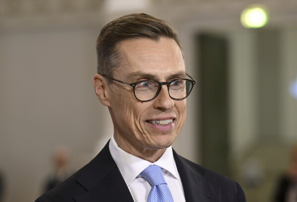 National Coalition Party candidate Alexander Stubb smiles, during a Presidential election event, at the Helsinki City Hall, in Helsinki, Finland, Sunday, Jan. 28, 2024. A projection in Finland says Alexander Stubb has won the first round of the presidential election to set up a Feb 11 runoff. (Markku Ulander/Lehtikuva via AP)