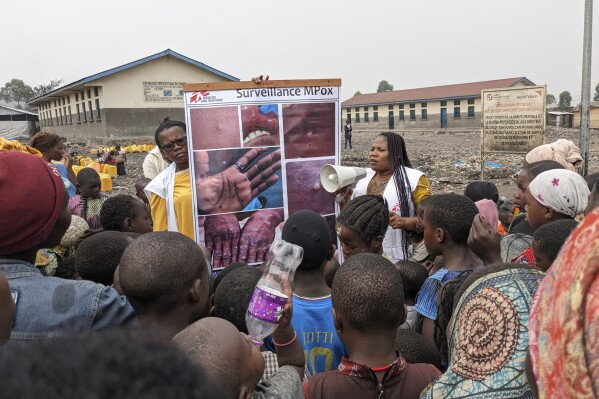 This photo supplied by MSF (Doctors Without Borders) dated May 31, 2023, shows health workers educating children on the symptoms of the mpox disease in Goma, Congo. (Augustin Mudiayi/Doctors Without Borders/Médecins Sans Frontières via AP)