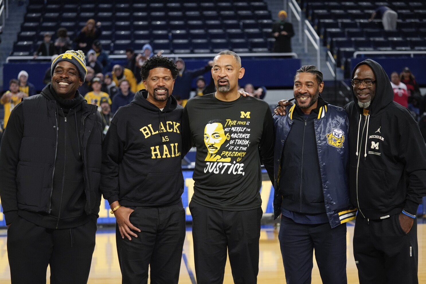 Michigan's Fab Five reunites to support Howard, attends 1st basketball game  at Crisler in 3 decades