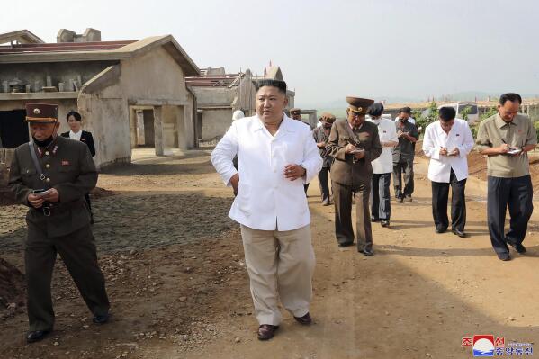 FILE - In this undated photo provided on July 23, 2020 by the North Korean government, North Korean leader Kim Jong Un, center, visits a new chicken farm being built in Hwangju County, North Korea. Independent journalists were not given access to cover the event depicted in this image distributed by the North Korean government. The content of this image is as provided and cannot be independently verified. Korean language watermark on image as provided by source reads: "KCNA" which is the abbreviation for Korean Central News Agency. (Korean Central News Agency/Korea News Service via AP, File)