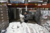 Driver Carlos Quezada loads rice on a pallet for distribution at Feeding Westchester in Elmsford, NY, Wednesday, Nov.  15, 2023. A growing number of states are working to keep food out of landfills over concerns that it is taking up too much space and posing environmental problems.  Some states including New York are requiring supermarkets and other businesses to redirect food to food pantries.  (AP Photo/Seth Wenig)