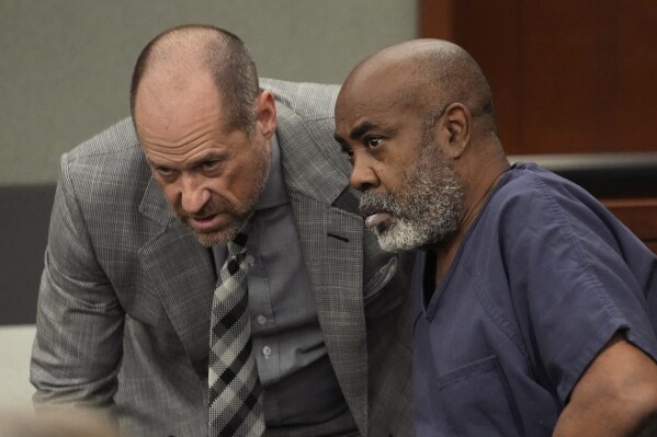 Duane "Keffe D" Davis, right, speaks with attorney Ross Goodman in court Thursday, Oct. 19, 2023, in Las Vegas. Davis has been charged with killing Tupac Shakur in 1996. (AP Photo/John Locher, Pool)