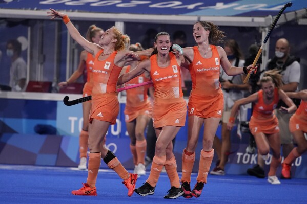 FILE - Netherlands players celebrate after beating Argentina in the women's gold medal field hockey match during the 2020 Summer Olympics, Friday, Aug. 6, 2021, in Tokyo, Japan. (AP Photo/John Locher, File)
