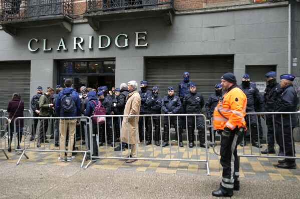 Police guard outside the front entrance of the event venue as the National Conservatism conference takes place in Brussels, Tuesday, April 16, 2024. (AP Photo/Virginia Mayo)