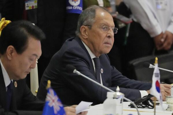 FILE - Sitting next to South Korea President Yoon Suk Yeol, left, Russian Foreign Minister Sergey Lavrov listens during the ASEAN Australia-New Zealand Trade Area (AANZTA) in Phnom Penh, Cambodia, Sunday, Nov. 13, 2022.  Lavrov has been taken to the hospital after suffering a health problem following his arrival for the Group of 20 summit in Bali, Indonesian authorities said Monday. (AP Photo/Heng Sinith, File)
