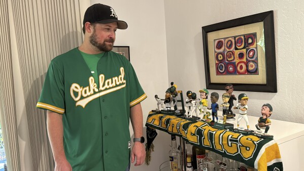 Ken Rettberg, a longtime Oakland A's fan, is disappointed with the baseball team's planned departure to Las Vegas and taxpayer dollars subsidizing new sports venues.  Pleasant Hill, California.  December 19, 2023.  (AP Photo/Terry Chia)
