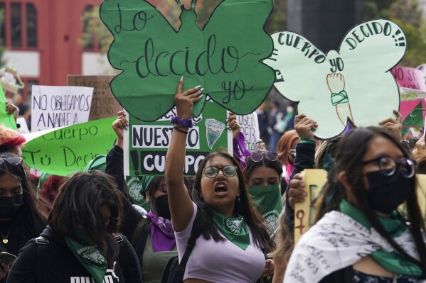 A woman holds up a sign with a message that reads in Spanish; "I will decide" as she joins a march demanding legal, free and safe abortions for all women, marking International Safe Abortion Day, in Mexico City, Sept. 28, 2022. Mexico’s Supreme Court on Wednesday, Sept. 6, 2023, has decriminalized abortion nationwide. (AP Photo/Marco Ugarte, File)