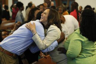 Sen. Kamala Harris, D-Calif., meets people before a Corinthian Baptist Church service, Sunday, Aug. 11, 2019, in Des Moines, Iowa. Harris, tapped on Tuesday, Aug. 11, 2020 as Joe Biden’s running mate, attended services at both a Black Baptist church and a Hindu temple growing up. (AP Photo/John Locher)