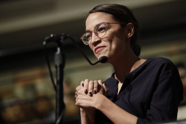 
              Democrat Alexandria Ocasio-Cortez, who won her bid for a seat in the House of Representatives in New York's 14th Congressional District, asks 2014 Nobel Laureate Malala Yousafzai a question at the Kennedy School's Institute of Politics at Harvard University in Cambridge, Mass., Thursday, Dec. 6, 2018. (AP Photo/Charles Krupa)
            