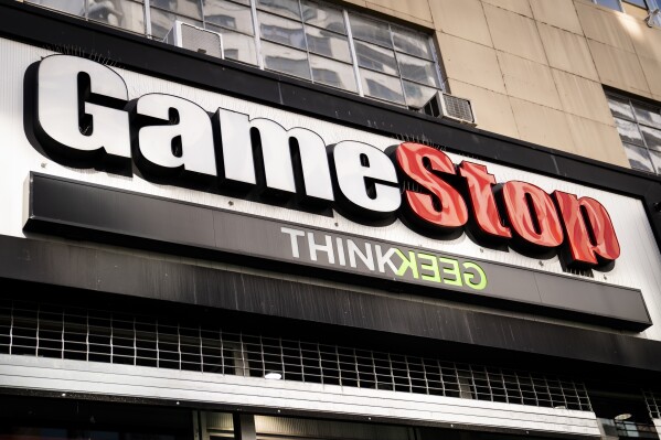 FILE - Pedestrians pass a GameStop store on 14th Street at Union Square, Thursday, Jan. 28, 2021, in the Manhattan borough of New York. Billionaire Ryan Cohen, the largest individual investor in GameStop, is taking over as CEO at the video game retailer, Thursday, Sept. 28, 2023. Cohen is already the board chairman and the company's largest individual investor.(AP Photo/John Minchillo, File)