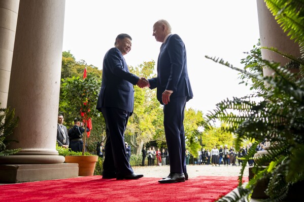 FILE -President Joe Biden, right, greets China's President President Xi Jinping, left, at the Filoli Estate in Woodside, USA, Wednesday, Nov. 15, 2023. The National Security Council says high-level U.S. government envoys raised concerns about “the misuse of AI” by China and others in closed-door talks with Chinese officials in Geneva. NSC spokesperson Adrienne Watson said the countries exchanged perspectives on AI safety and risk management in “candid and constructive” discussions a day earlier. (Doug Mills/The New York Times via AP, Pool, File)