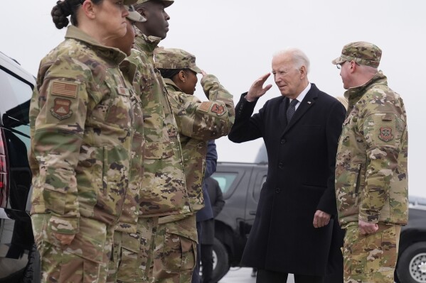 President Joe Biden greets service members after arriving at Dover Air Force Base, Del., Friday, Feb. 2, 2024. (AP Photo/Alex Brandon)