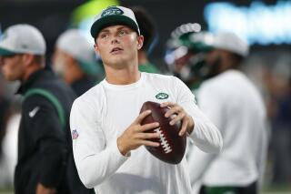New York Jets quarterback Zach Wilson warms up before an NFL preseason football game against the Philadelphia Eagles Friday, Aug. 27, 2021, in East Rutherford, N.J. (AP Photo/Noah K. Murray)