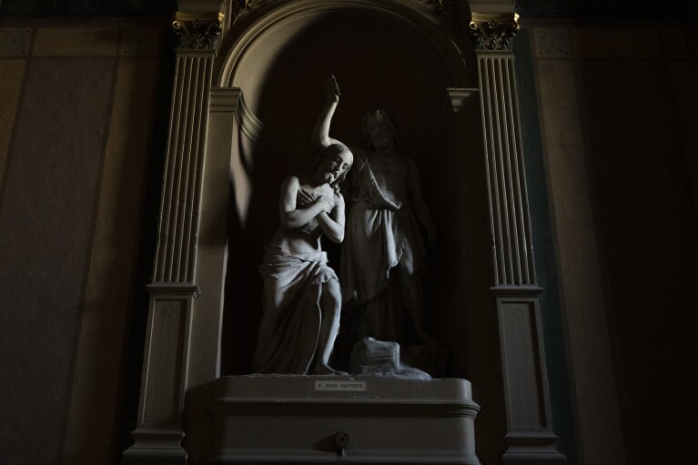 A statue of Saint Jean Baptiste is displayed at the Notre-Dame du Mont church in Marseille, southern France, Thursday, April 25, 2024. (AP Photo/Daniel Cole)