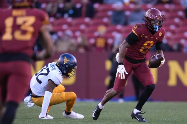 Iowa State wide receiver Xavier Hutchinson (8) breaks a tackle by West Virginia safety Raleigh Collins III (32) after catching a pass during the second half of an NCAA college football game, Saturday, Nov. 5, 2022, in Ames, Iowa. Iowa State 31-14. (AP Photo/Charlie Neibergall)