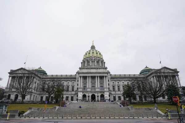 FILE - The Pennsylvania Capitol is seen, Feb. 21, 2023, in Harrisburg, Pa. Democrats who control the state House of Representatives on Tuesday, Nov. 14, advanced an estimated $1.8 billion boost to the pensions of Pennsylvania state government and public school retirees, with supporters saying they have been hard hit by inflation. (AP Photo/Matt Rourke, File)