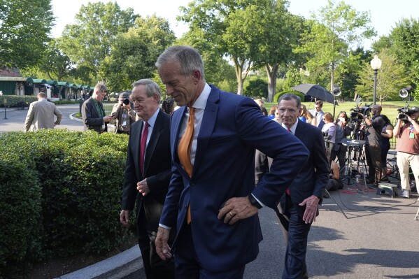 Senate Majority Leader John Thune, R-S.D., Sen. John Barrasso, R-Wyo., right, and Sen. Mike Crapo, R-Idaho, walks from the microphones after speaking with reporters following their meeting with President Donald Trump at the White House, Wednesday, June 4, 2025, in Washington. (AP Photo/Alex Brandon)
