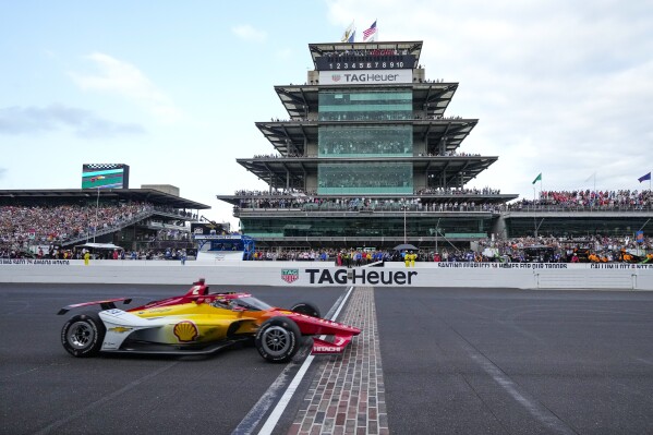 Josef Newgarden crosses the finish line to win the Indianapolis 500 auto race at Indianapolis Motor Speedway in Indianapolis, Sunday, May 26, 2024. (AP Photo/AJ Mast, file)