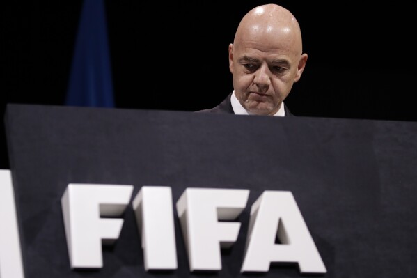 FILE -FIFA President Gianni Infantino walks on the stage before the start of the 69th FIFA congress in Paris, Wednesday, June 5, 2019. FIFA has been told to reschedule its inaugural expanded Club World Cup just over a year before the tournament is due to be hosted by America. (Ǻ Photo/Alessandra Tarantino, File)