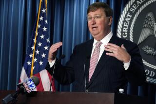 Mississippi Gov. Tate Reeves speaks about the state contracting with four vendors to provide over 1,000 medical personnel to multiple hospitals statewide to meet the staffing shortages due to the COVID-19 pandemic, during a news briefing Tuesday, Aug. 24, 2021, in Jackson, Miss. (AP Photo/Rogelio V. Solis)
